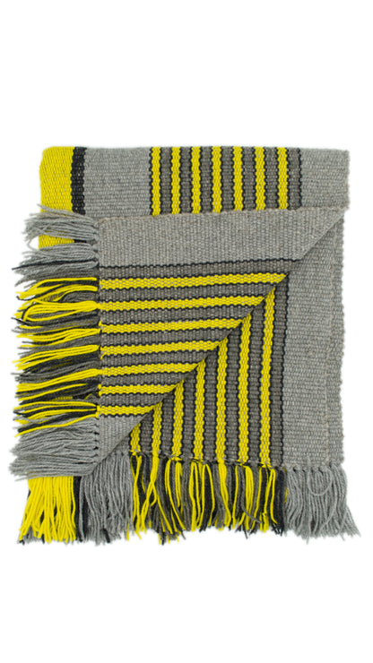 Close-up of Ranco Slate and Citrus wool throw rug showing Witral hand-weave texture
