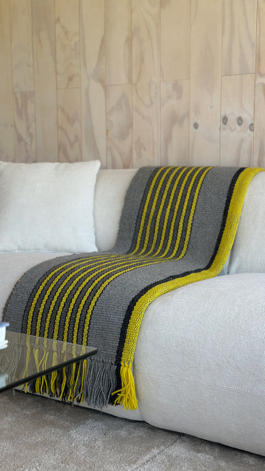 Ranco Slate and Citrus wool rug styled on floor showing full length – 100 x 226cm, Andean Home