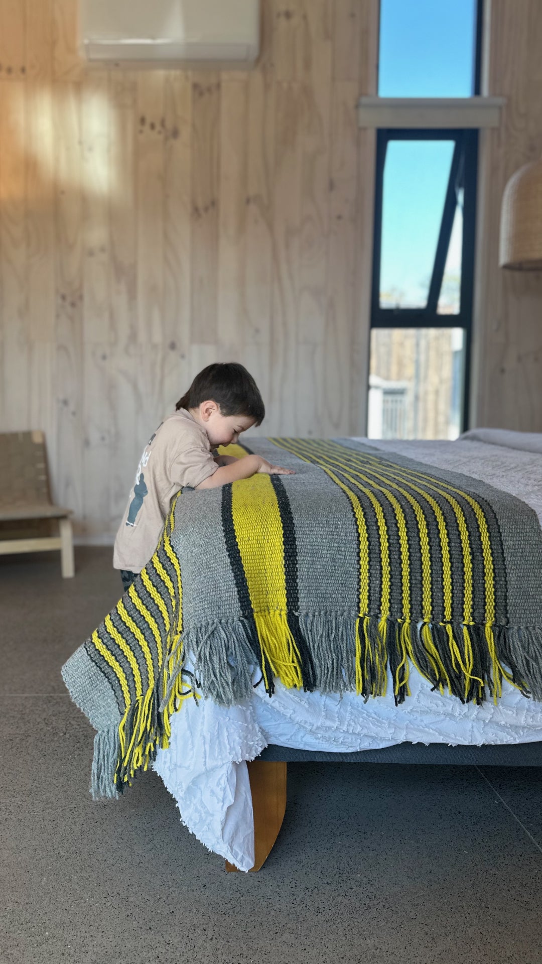 Ranco Slate and Citrus wool rug product shot showing full weave and citrus yellow stripe detail