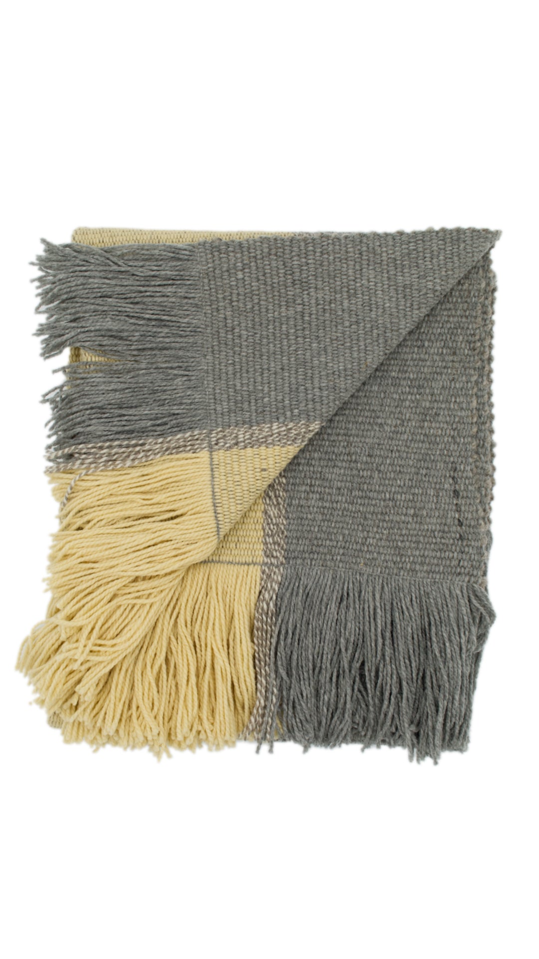 Ranco Dune and Stone wool throw rug draped over a sofa – 100% sheep's wool, Andean Home Australia
